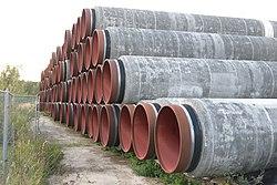 Stack of pipes that make up the Nord Stream 2 pipeline, made from steel with a concrete casing, tags: danmark ruslands om - CC BY-SA