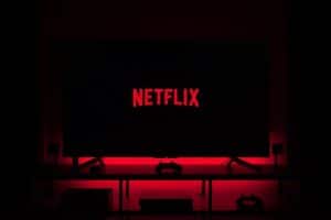 flat screen television displaying Netflix logo - Dark Netflix and Chill from home, tags: gratis - unsplash