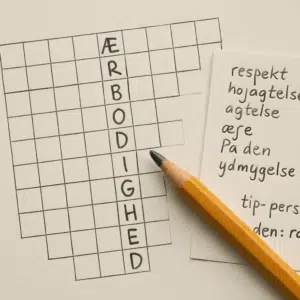 Krydsord med ordet ’ærbødighed’, blyant og notater med synonymer, tips og løsningsord